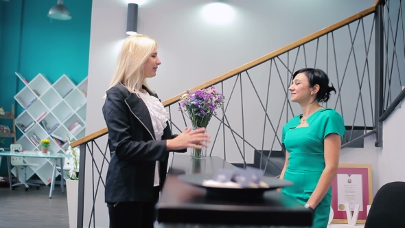 Blonde Woman at the Reception Desk