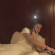 A Young Man Talking on the Phone in the Hotel Bed - VideoHive Item for Sale