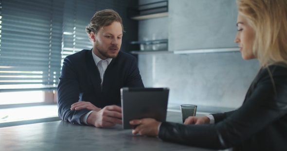 Business People Discussion Over Tablet Computer In Office