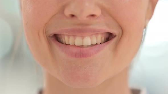 Close Up of Mouth of Young Woman Smiling 