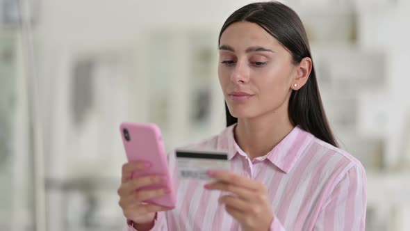 Portrait of Latin Woman Making Successful Online Payment on Smartphone