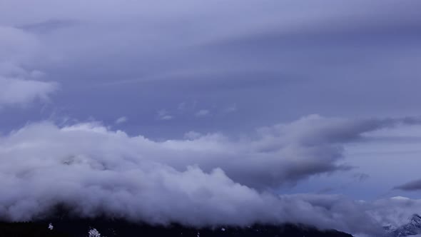 Time Lapse View of Puffy Clouds Over the Canadian Mountain Landscape