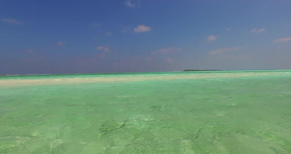 Tropical drone abstract view of a white sand paradise beach and blue sea background in vibrant 4K