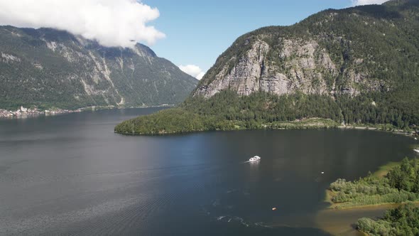 Aerial view Lake Hallstätter See, boat and mountains Alps, Hallstatt, Austria