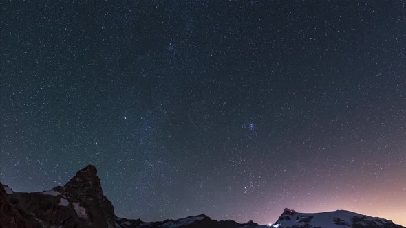 Time lapse: stars over the majestic Matterhorn summit, night sky over the Cervino mountain peak