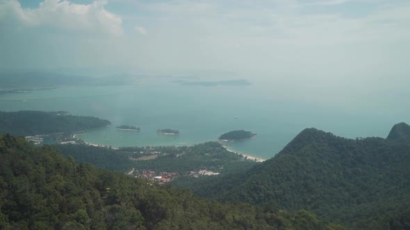Aerial view of the Andaman sea and a dense tropical forest