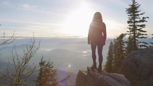 Adventurous Caucasian Adult Woman Hiking in Canadian Nature