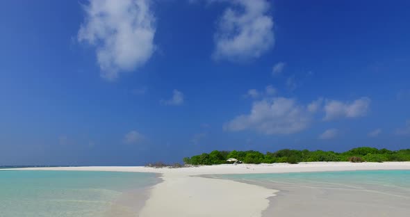 Beautiful flying abstract shot of a white sand paradise beach and aqua blue water background in vibrant