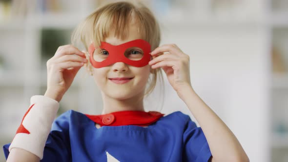 Small Girl Wearing Superhero Eye Mask