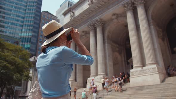 Young girl with camera at the museum