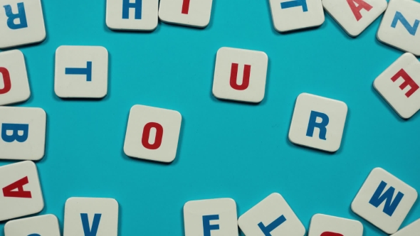 Word Tour Formed of Blue and Red Letters on the Skyblue Background. Stop Motion alt
