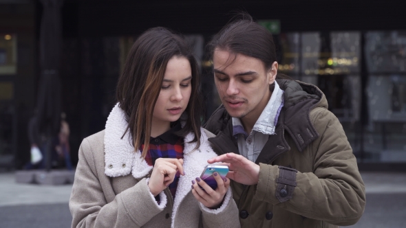 Young Couple with Smartphone
