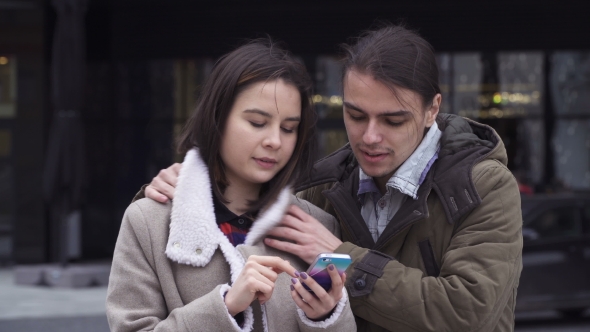 Young Couple with Smart Phone