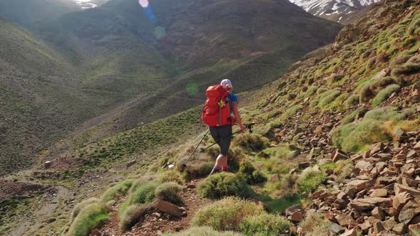 Backpacker girl on a hike in Atlas mountains, Morocco