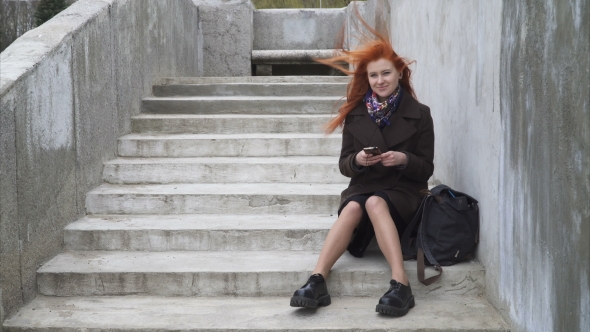 Woman with Headphones and Smartphone