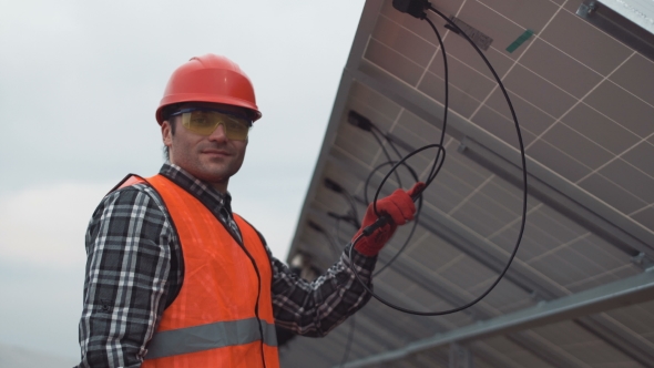 Worker Mounting Solar Panels