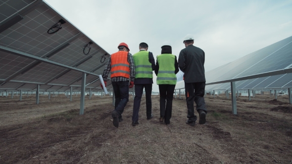 People Walking Away in Solar Panels