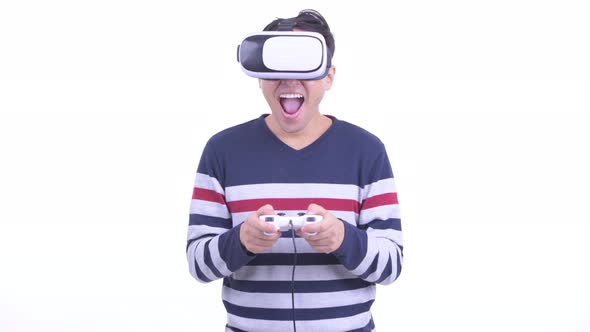 Happy Japanese Hipster Man Playing Games and Using Virtual Reality Headset