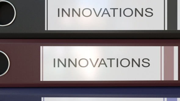 Vertical Stack of Multicolor Office Binders with Innovations Tags alt