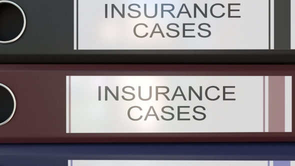 Vertical Stack of Multicolor Office Binders with Insurance Cases Tags