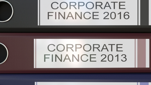 Vertical Stack of Multicolor Office Binders with Corporate Finance Tags Different Years alt