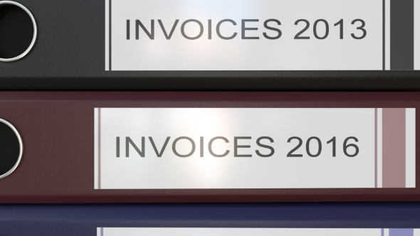 Vertical Stack of Multicolor Office Binders with Invoices Tags Different Years