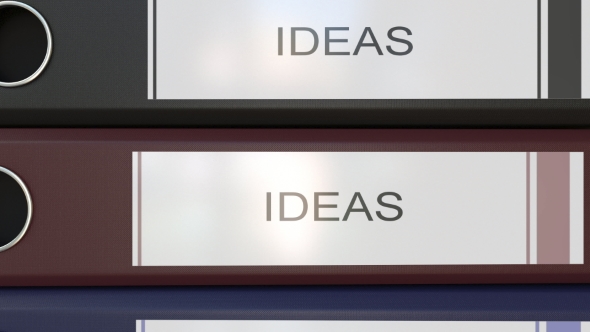 Vertical Stack of Multicolor Office Binders with Ideas Tags alt