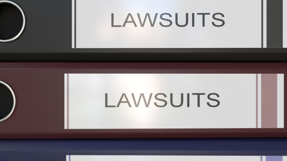 Vertical Stack of Multicolor Office Binders with Law Suits Tags alt