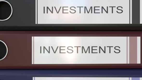 Vertical Stack of Multicolor Office Binders with Investments Tags alt