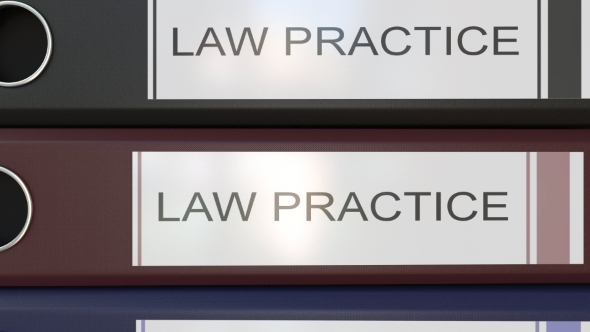 Vertical Stack of Multicolor Office Binders with Law Practice Tags