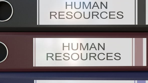 Vertical Stack of Multicolor Office Binders with Human Resources Tags
