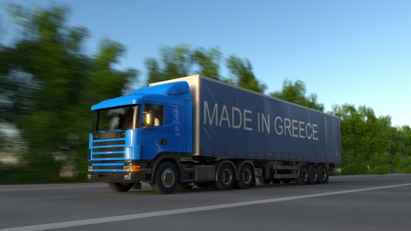 Speeding Freight Semi Truck with MADE IN GREECE Caption on the Trailer alt