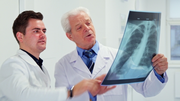 Two Male Doctors Look at X-ray