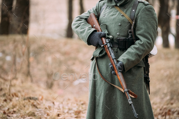  soldier at World War II. Warm autumn clothes, soldier’s overcoat, gloves, rifle