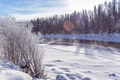 Winter snowy landscape by a river , Russia, Siberia Altai - PhotoDune Item for Sale