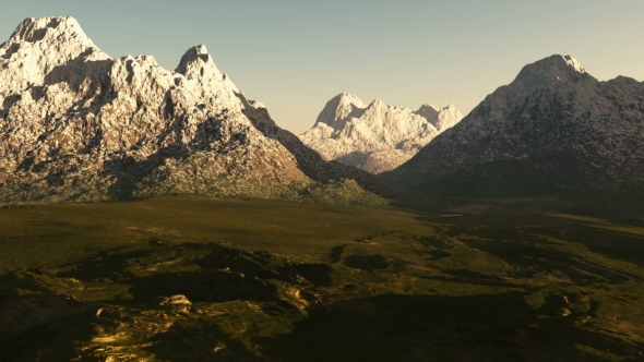 Green Valley and Mountains in Snow at Sunset alt