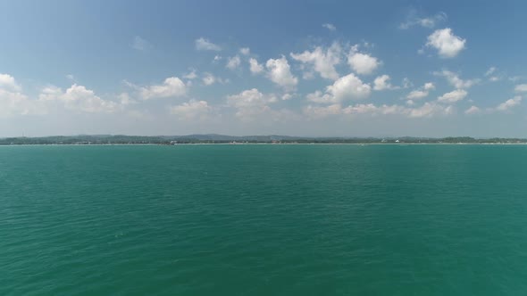 Flying Over Green Tropical Ocean 