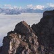 Aerial Shot of Climbers on Top of a Mountain High Above the Clouds - VideoHive Item for Sale