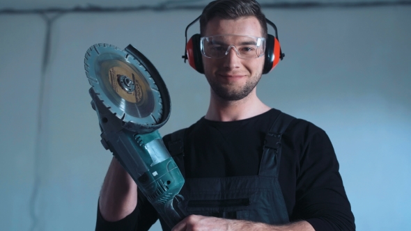 Smiling Construction Worker with Angle Grinder