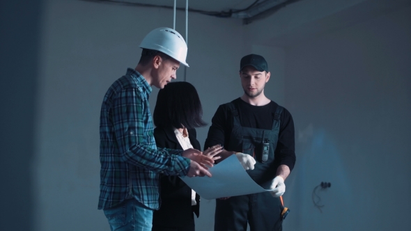 The Architects and Engineers Discussing Blueprint