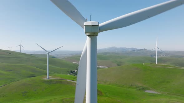 Close Up Aerial View of Large Rotating Windmill Generating Renewable Energy