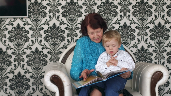 Grandmother and Little Boy Reading Book.