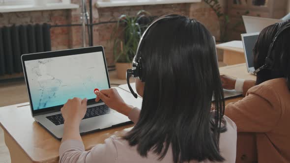 Female Call Center Operator Helping Customer