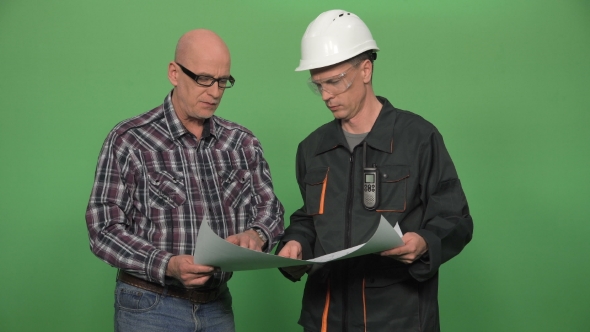 Architect Discussing the Blueprint with Worker