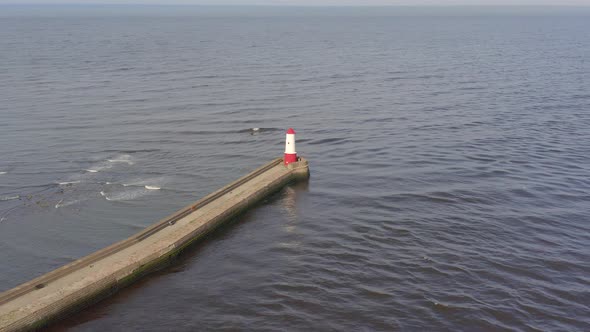 Berwick Breakwater and a Lighthouse in the Summer