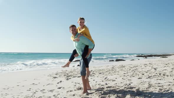 Couple in love enjoying free time on the beach together