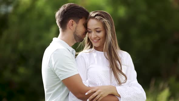 Romantic Couple. Man And Woman Kissing In Nature. Portrait Of Happy Young People