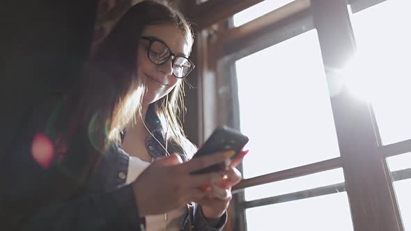 Close-up of Young Girl Texting on Phone 