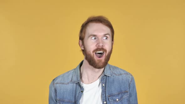 Crazy Redhead Man Doing Funny Movements Yellow Background