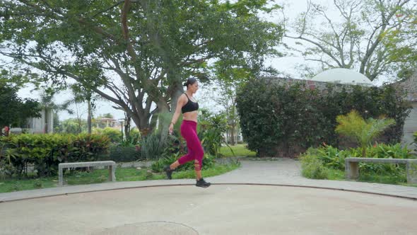 Woman Walking and Jumping Rope